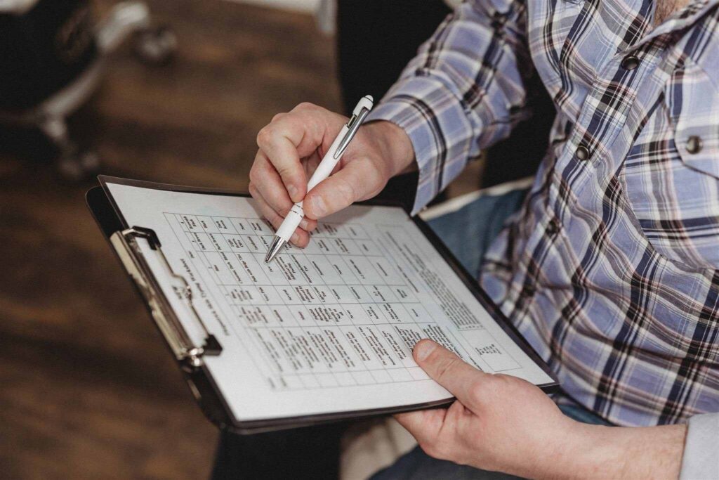 Client filling out intake forms before a Botox appointment at New You Health in Peoria, IL