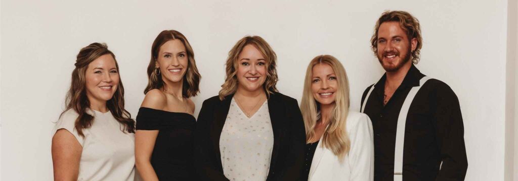Professional group photo of the New You Health team in Peoria, IL—specialists in Botox, facials, massage, weight loss, and aesthetic treatments—posing together to represent expert, compassionate care in medical aesthetics and wellness.