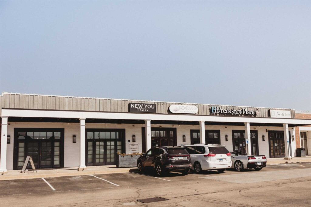 Front view of New You Health's med spa location in Junction City, Peoria, Illinois, featuring clear signage and parking in front of the entrance.
